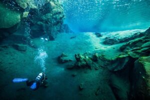 Dive the Divide: Silfra Fissure Scuba Tour | Meet at Thingvellir - Entering the water at the submerged platform