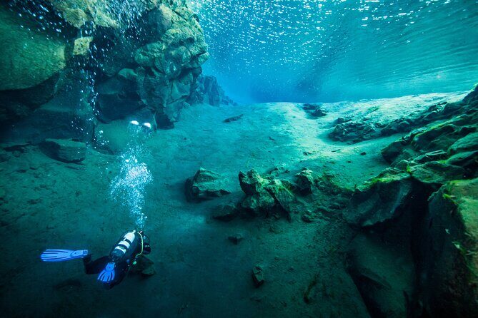 Dive the Divide: Silfra Fissure Scuba Tour | Meet at Thingvellir - Entering the water at the submerged platform